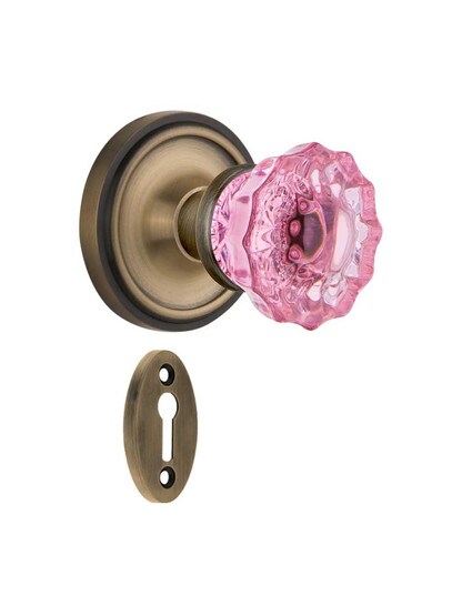 Classic Rosette Mortise Lock Set with Colored Fluted Crystal Glass Knobs Pink in Antique Brass.